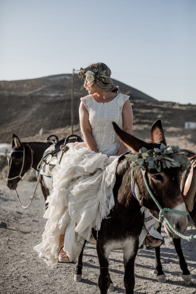 Bride rides mule after learning how to incorporate local culture after reading how to elope in Greece