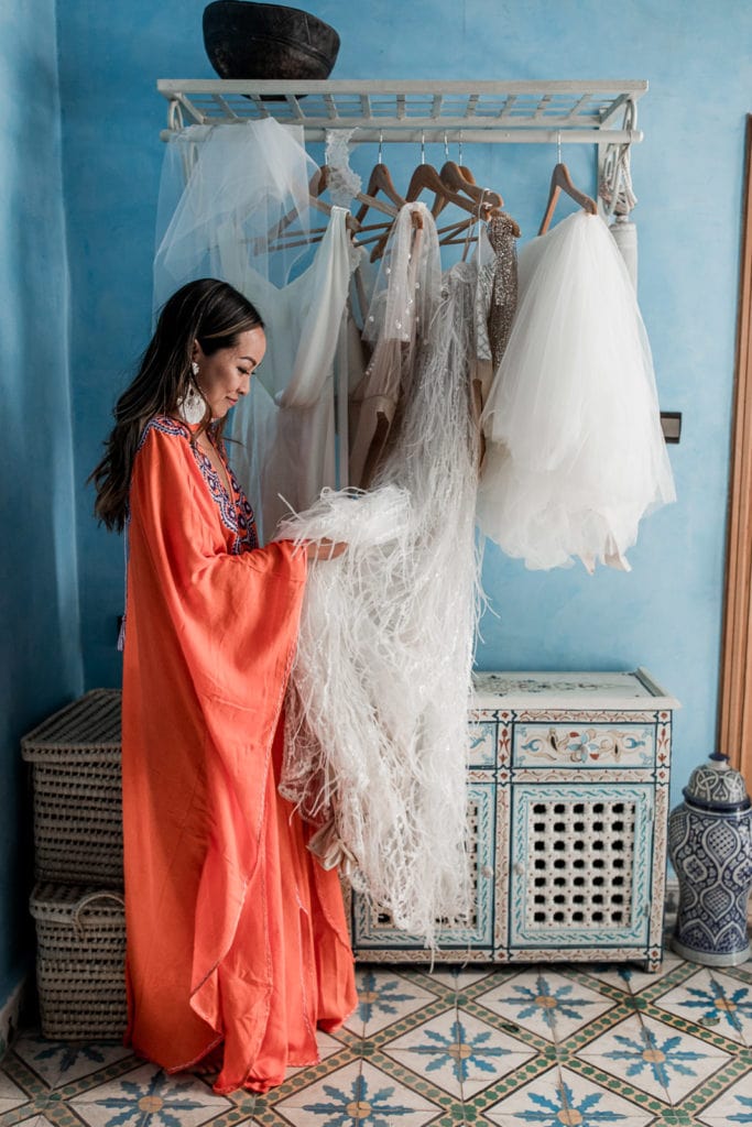 Bride wears orange kimono as she gets ready for her Marrakech wedding