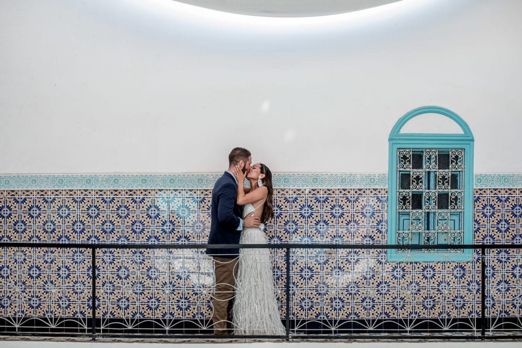 Bride and groom kiss during first look at Be Riad in Marrakech