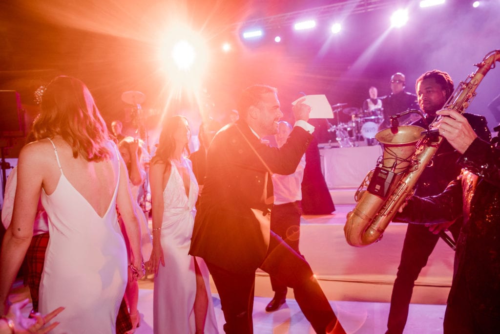Bride and groom dancing at wedding reception in Puglia