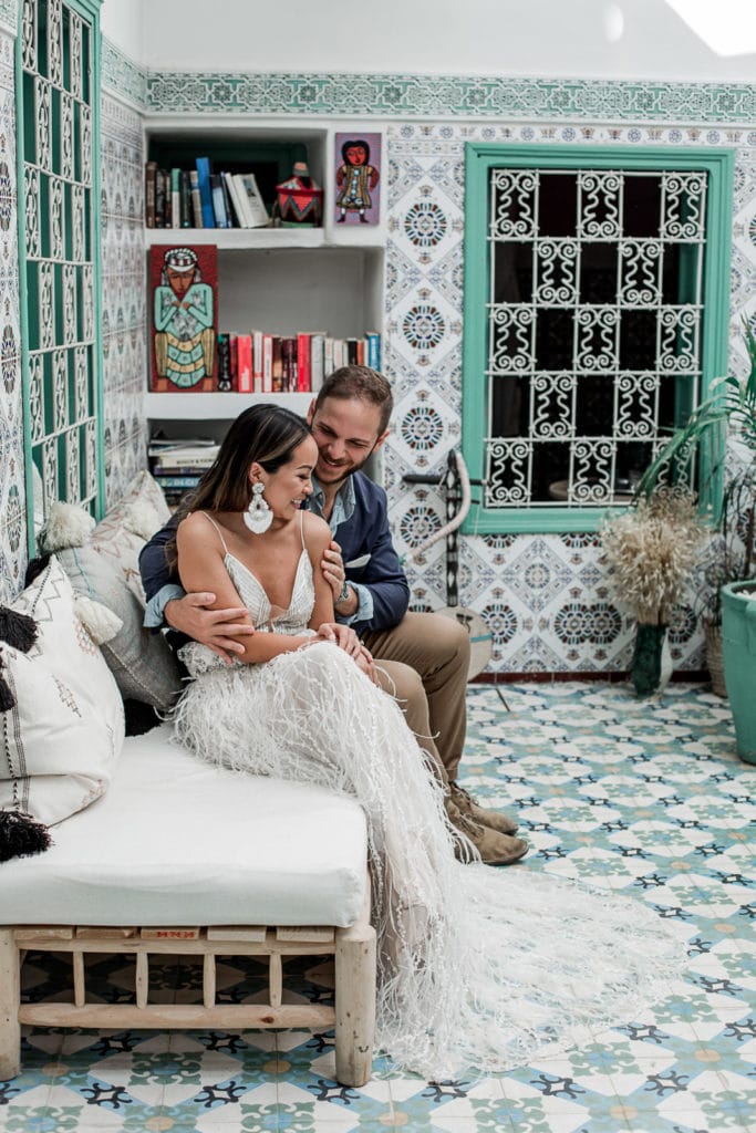 Bride and groom sit together at Be Riad in Marrakech, Morocco wedding venue