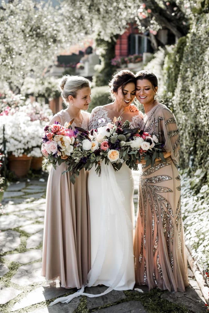 Bride stands with bridesmaids before Portofino hotel wedding