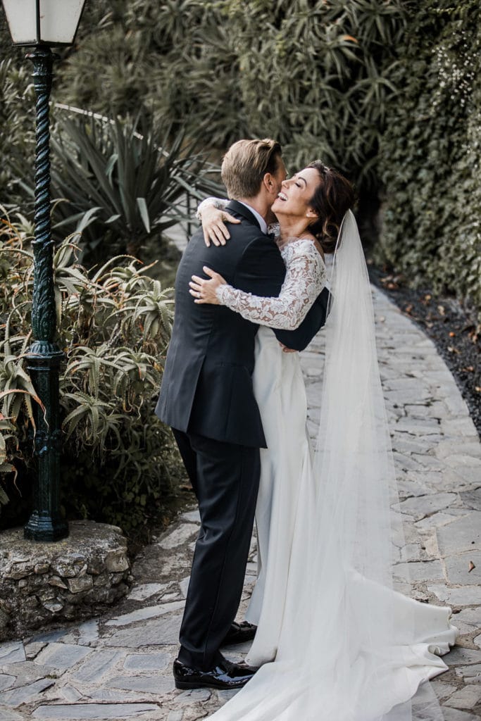 Bride and groom embrace in Portofino, Italy