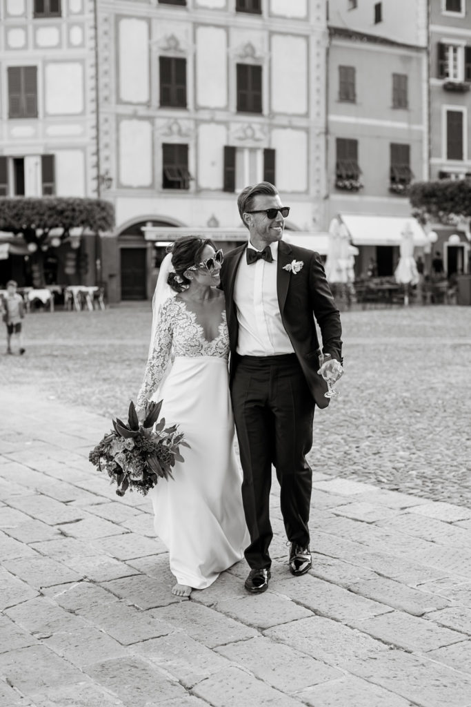 Bride and groom walking streets after Portofino hotel wedding