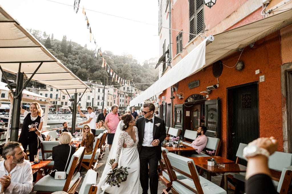 Bride and groom walking through Portofino, Italy