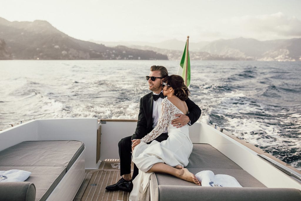 Bride and groom take boat ride during sunset portraits in Cinque Terre