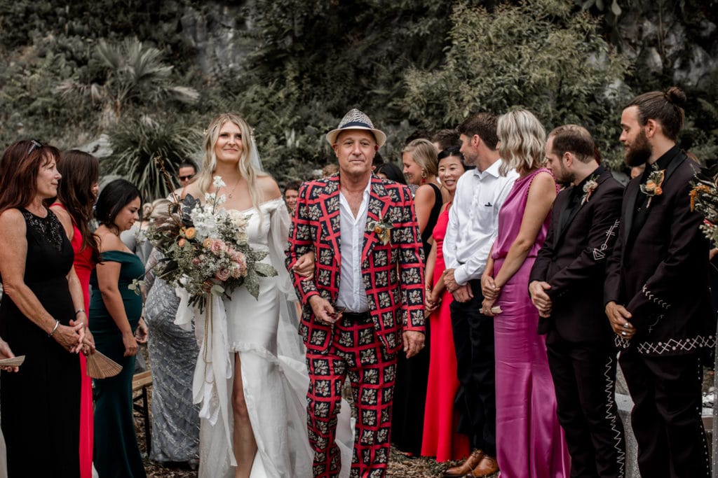 Father wears fashionable suit as he walks bride down the aisle at Villa Camilla, Lake Como wedding