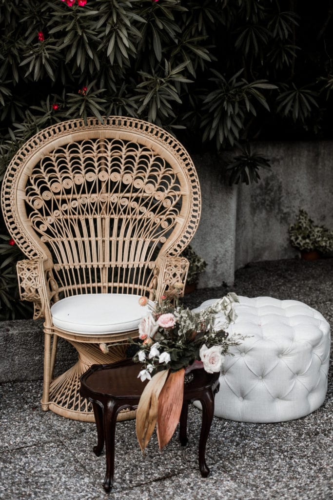 Bohemian-chic rattan lounge seating at wedding reception
