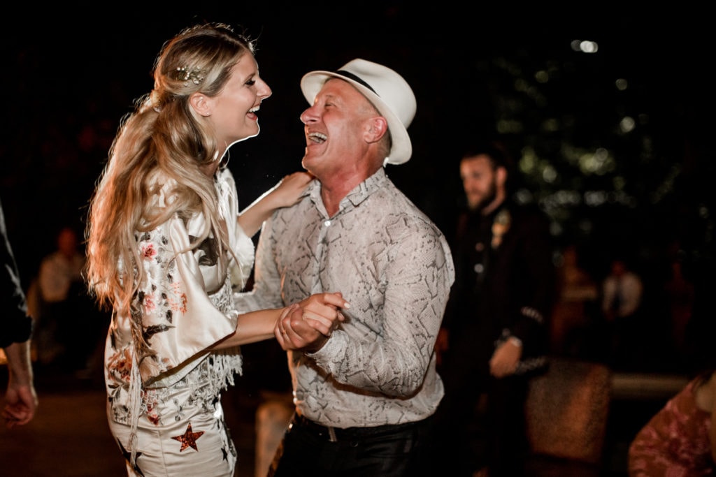 Father and bride dance together at wedding reception