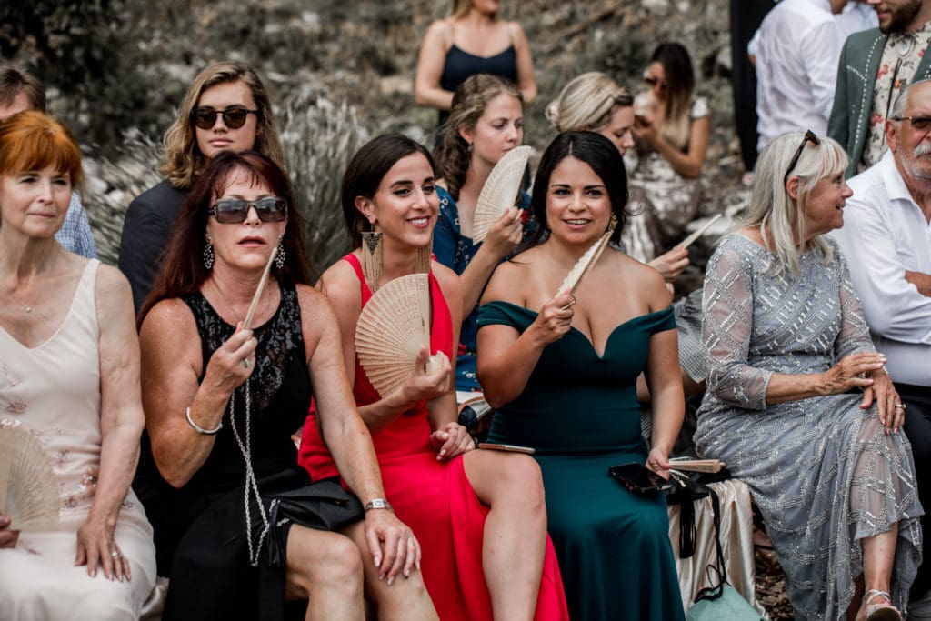 Fashionable guests wait for wedding ceremony to start