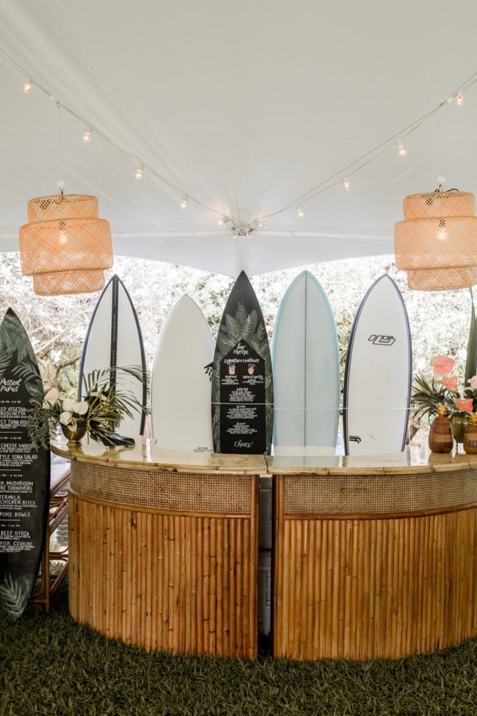 Destination wedding reception in Hawaii bar made of surfboards