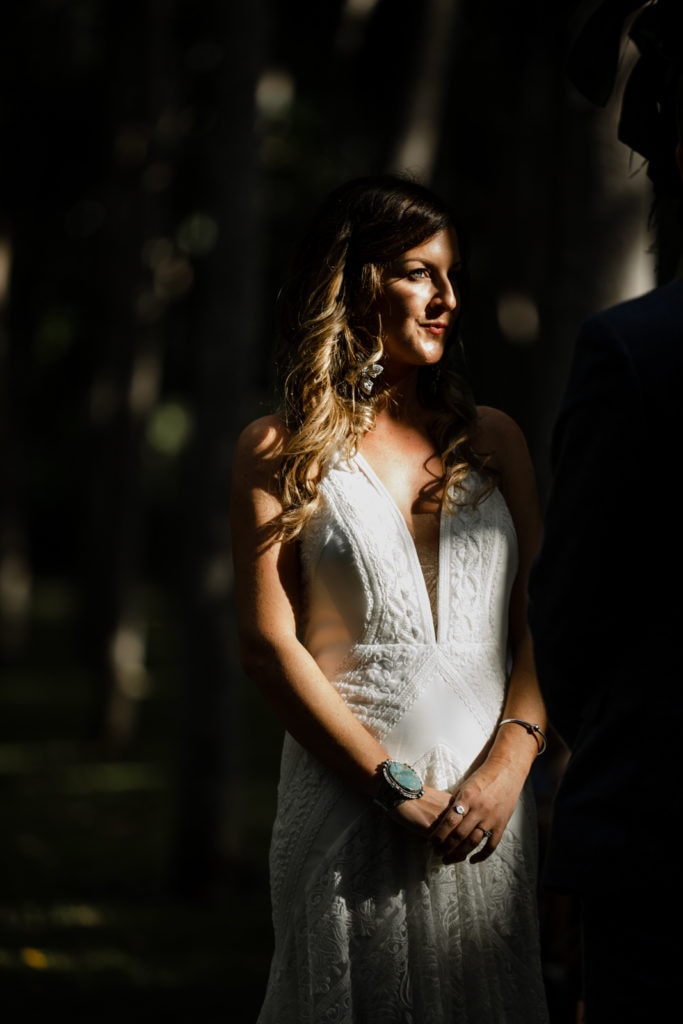 Bride shows the front of her Rue de Seine bridal gown for Na 'Aina Kai Botanical Gardens wedding