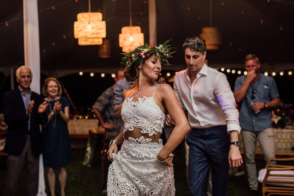 Bride and groom dance during destination Hawaii wedding reception