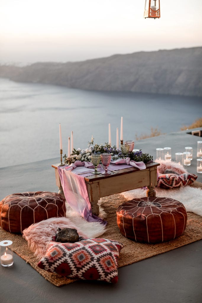 Private wedding reception for two on balcony overlooking ocean in Greece