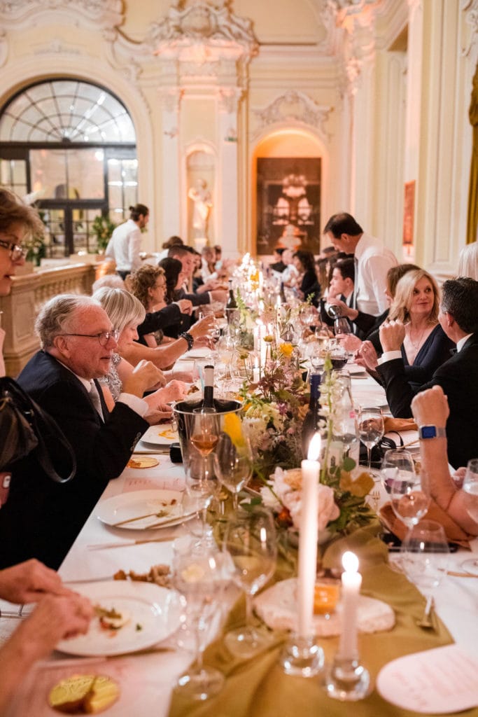 Guests enjoy a wedding reception at Vajdahunyad Castle in Budapest, Hungary