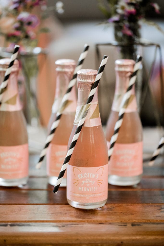 Mini bottles of champagne for bride and bridesmaids as they're getting ready