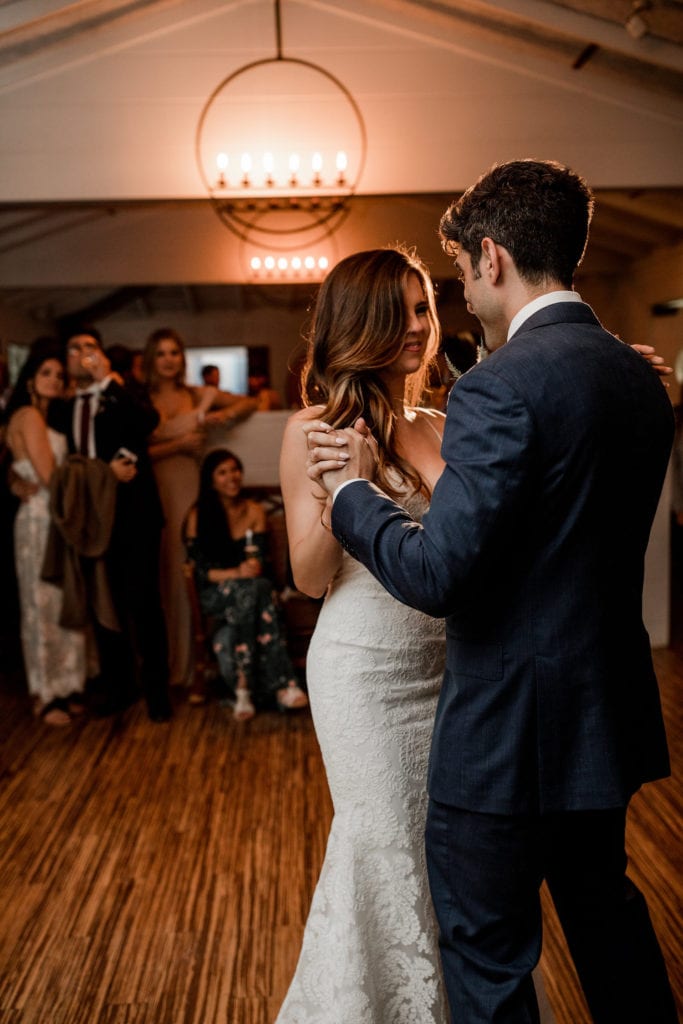 Bride and groom dance together at Big Sur wedding reception