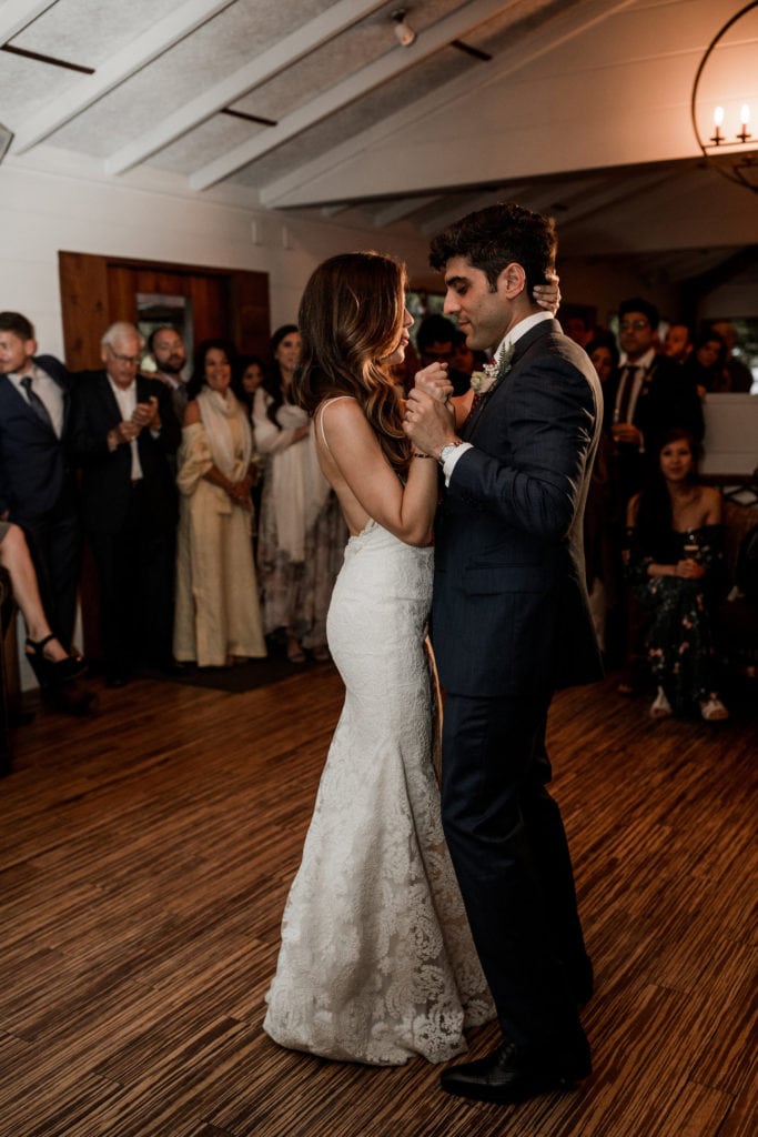 Bride and groom dance together during wedding reception