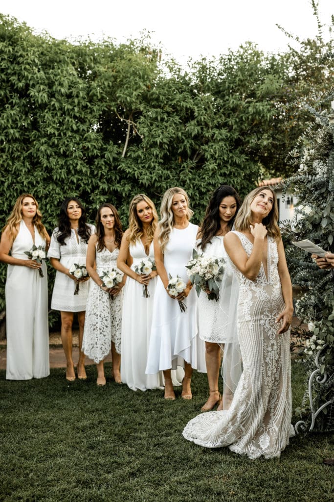 Bride stands with bridesmaids for ceremony at Colony Palms Hotel