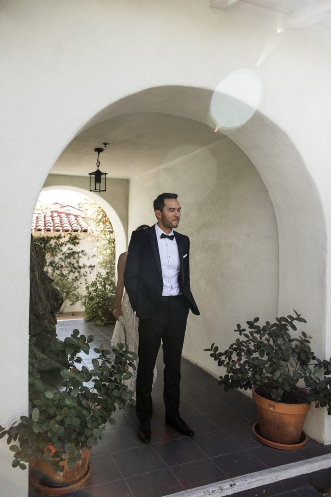 Groom waits for bride for Colony Palms Hotel wedding first look