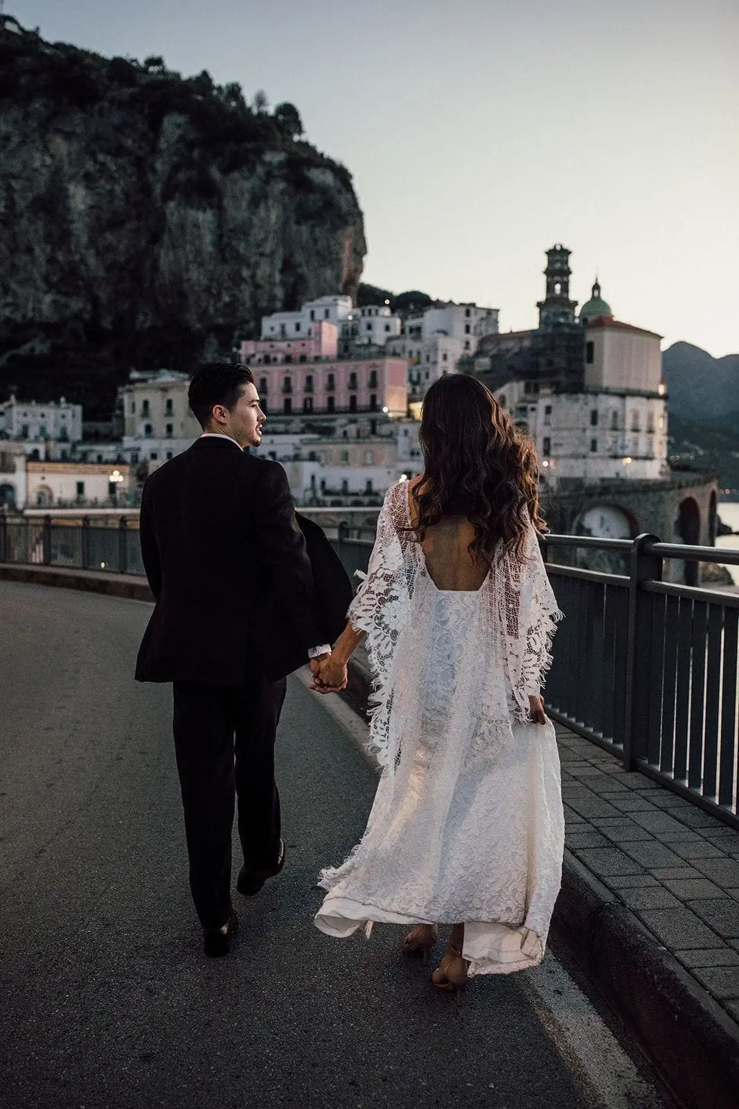 Couple walk down the streets in Atrani during sunrise