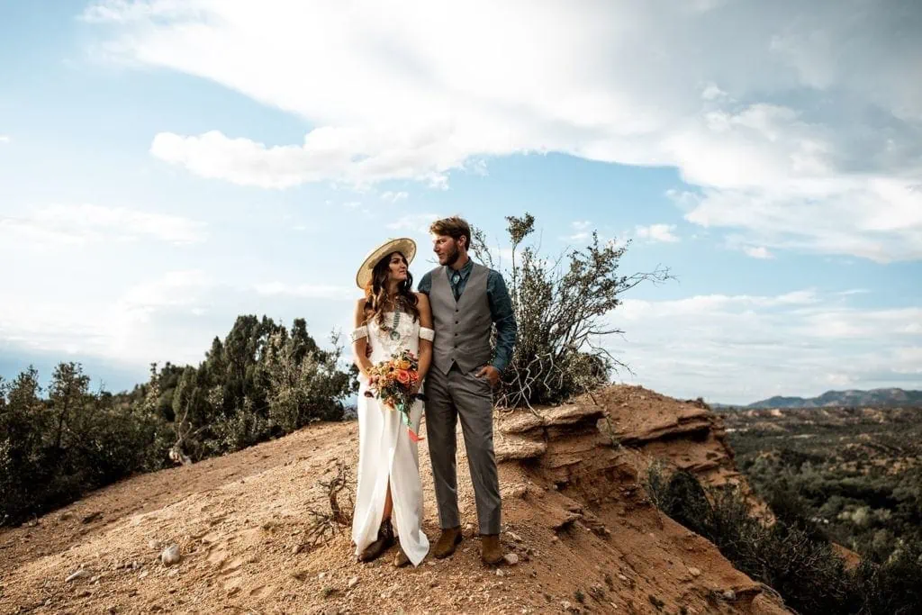 Bride and groom stand together for couple's portraits in Santa Fe New Mexico