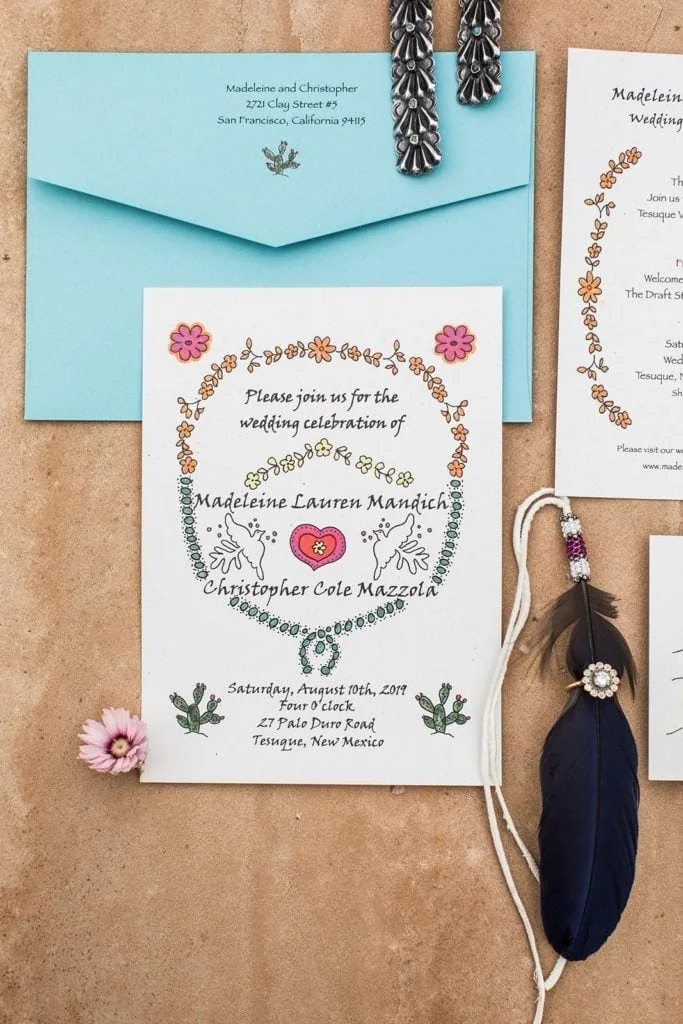 Southwestern inspired wedding invitation with turquoise envelopes