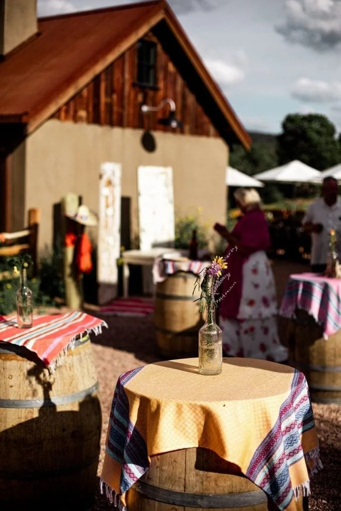 Southwestern outdoor wedding cocktail hour with handmade tablecloths from Mexico