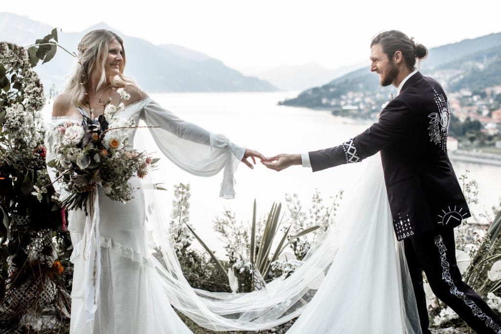 Bride and groom hold hands after their Villa Camilla Lake Como wedding ceremony