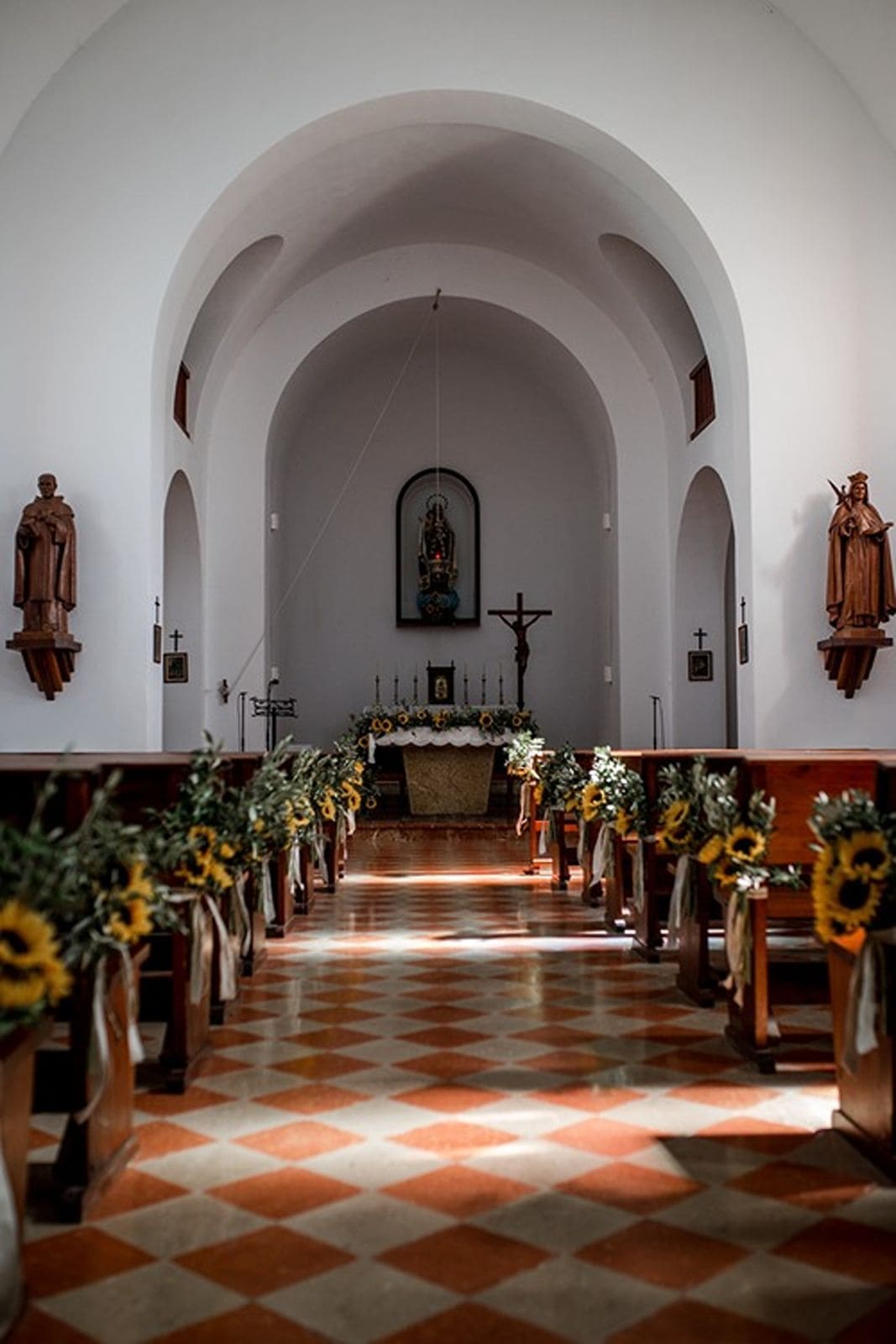Interior of Iglesia Es Cubells decorated for a Catholic wedding ceremony