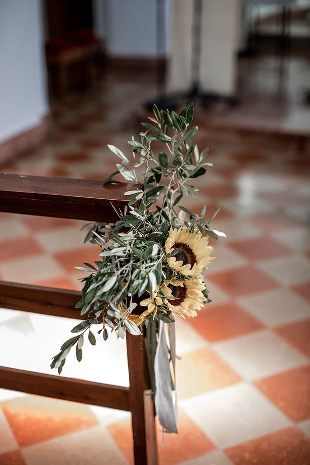 Sunflower rustic-chic floral arrangement in Catholic church wedding ceremony