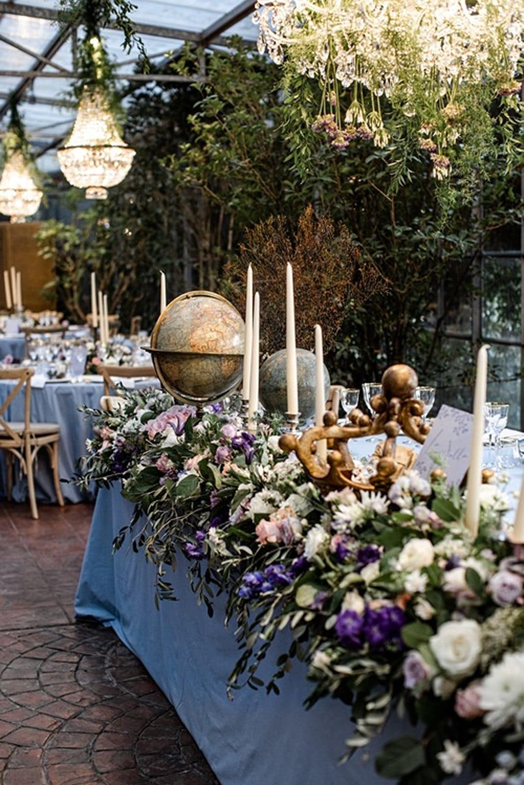 Banquet reception table with lavender tablecloth and full garden-inspired florals for centerpieces