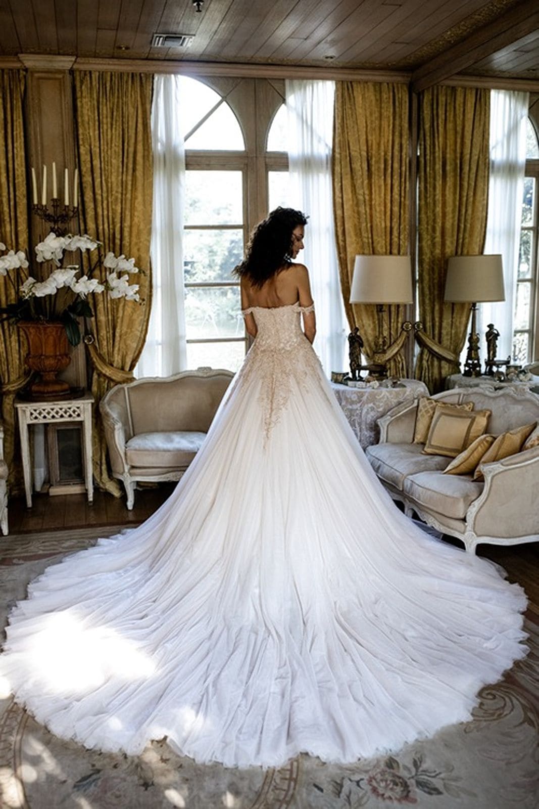 Bride wears a dramatic Atelier Emè bridal gown