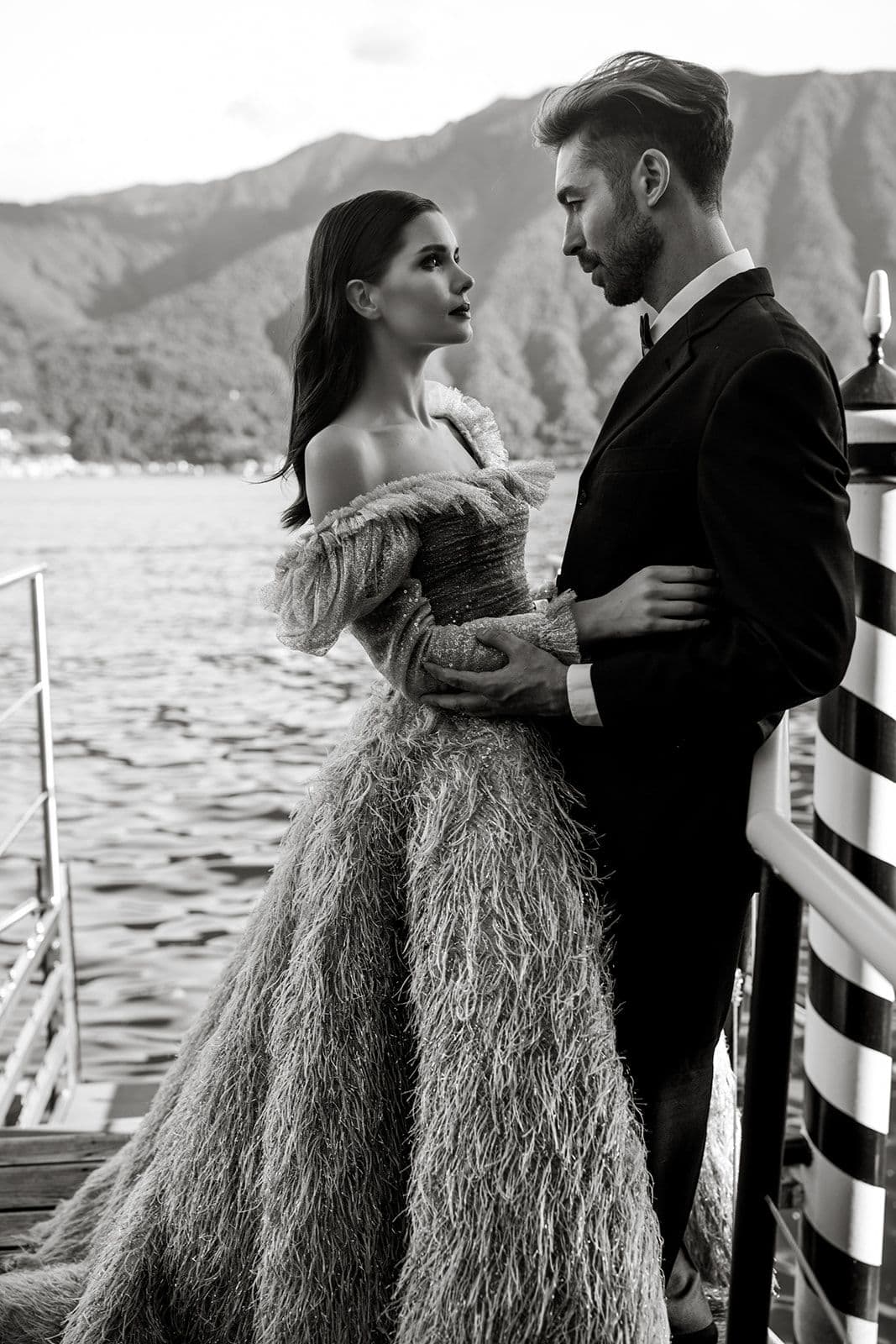 Bride and groom at Lake Como water's edge after elopement ceremony at Villa Balbiano
