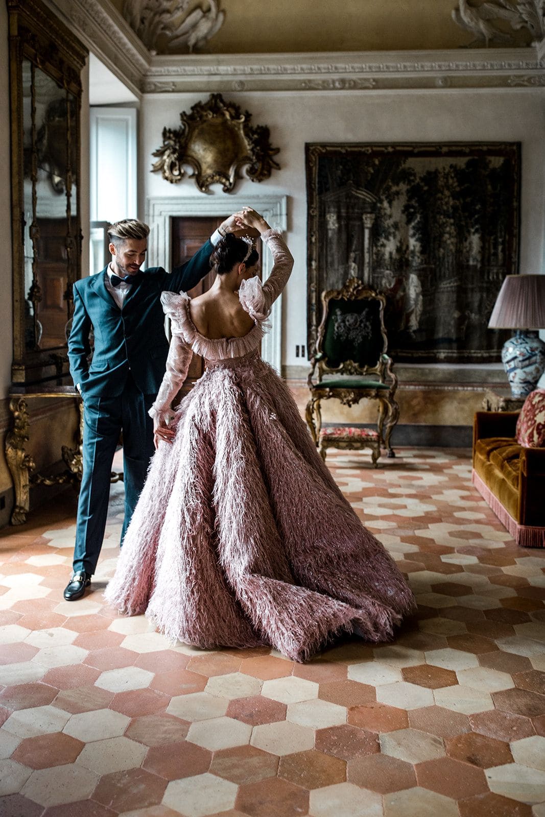 Groom spins bride during first look at Villa Balbiano