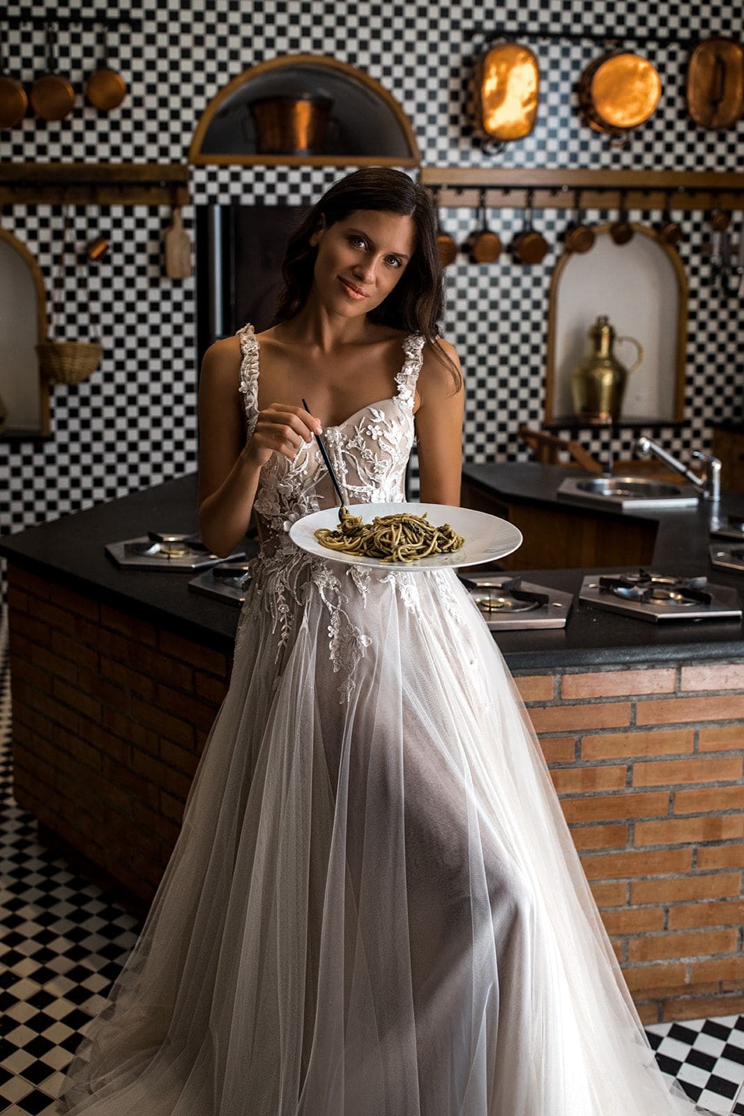 Bride in Villa Astor kitchen plate of pasta