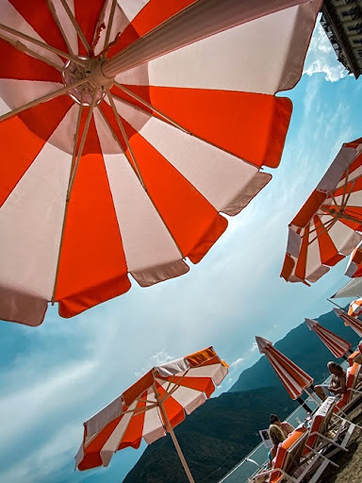 Red and white umbrellas in Lake Como Italy
