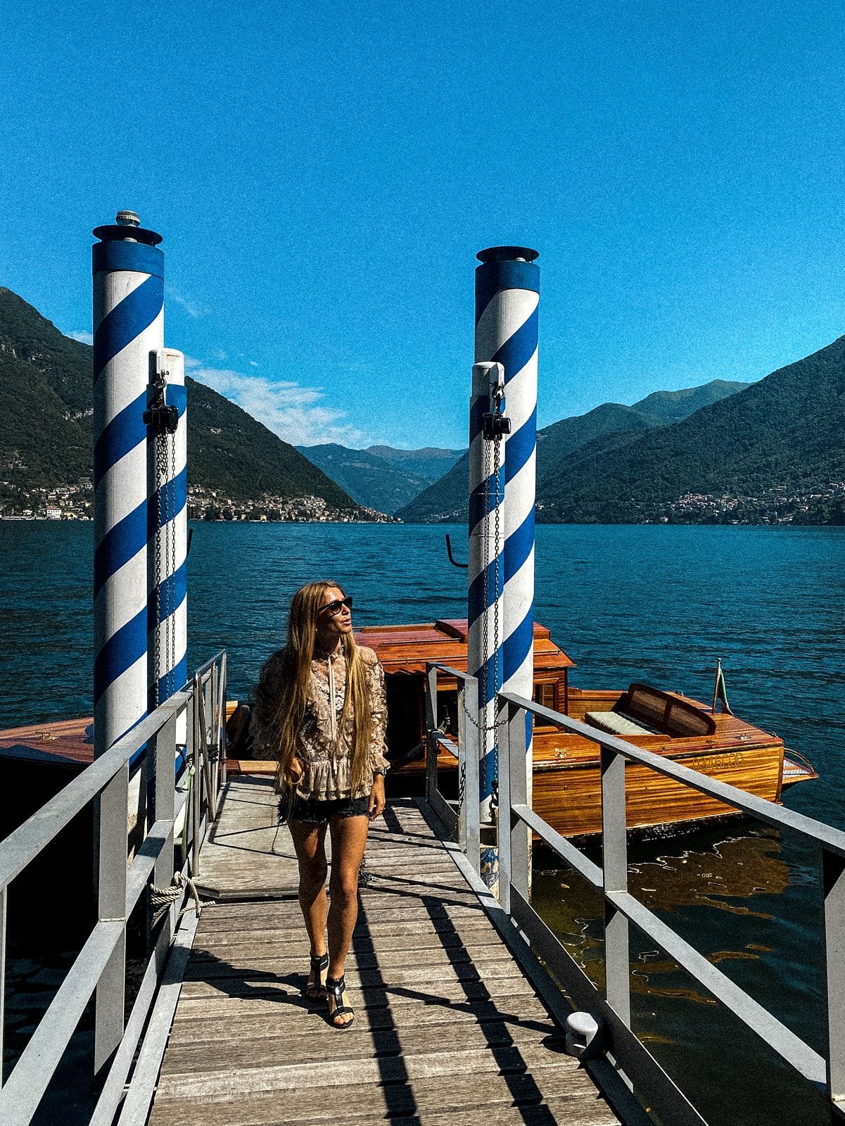 Woman on docks at Villa Pliniana lake como