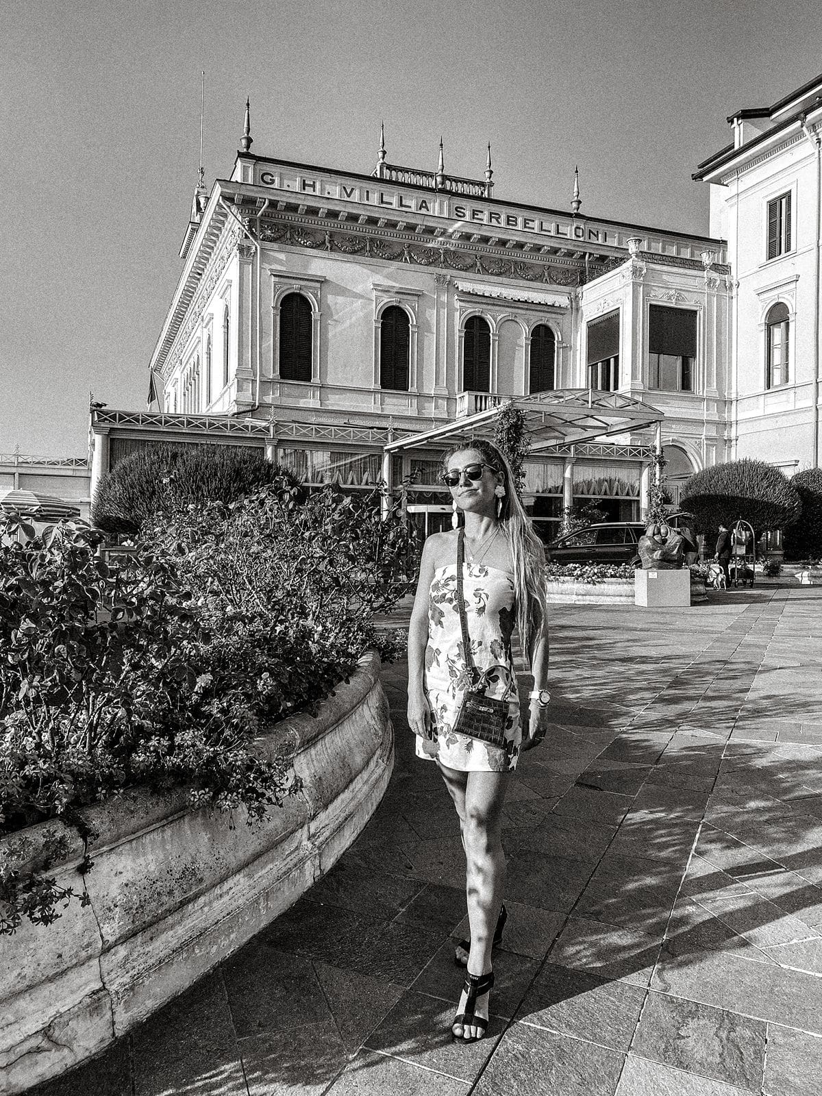 Woman stands outside Villa Serbelloni
