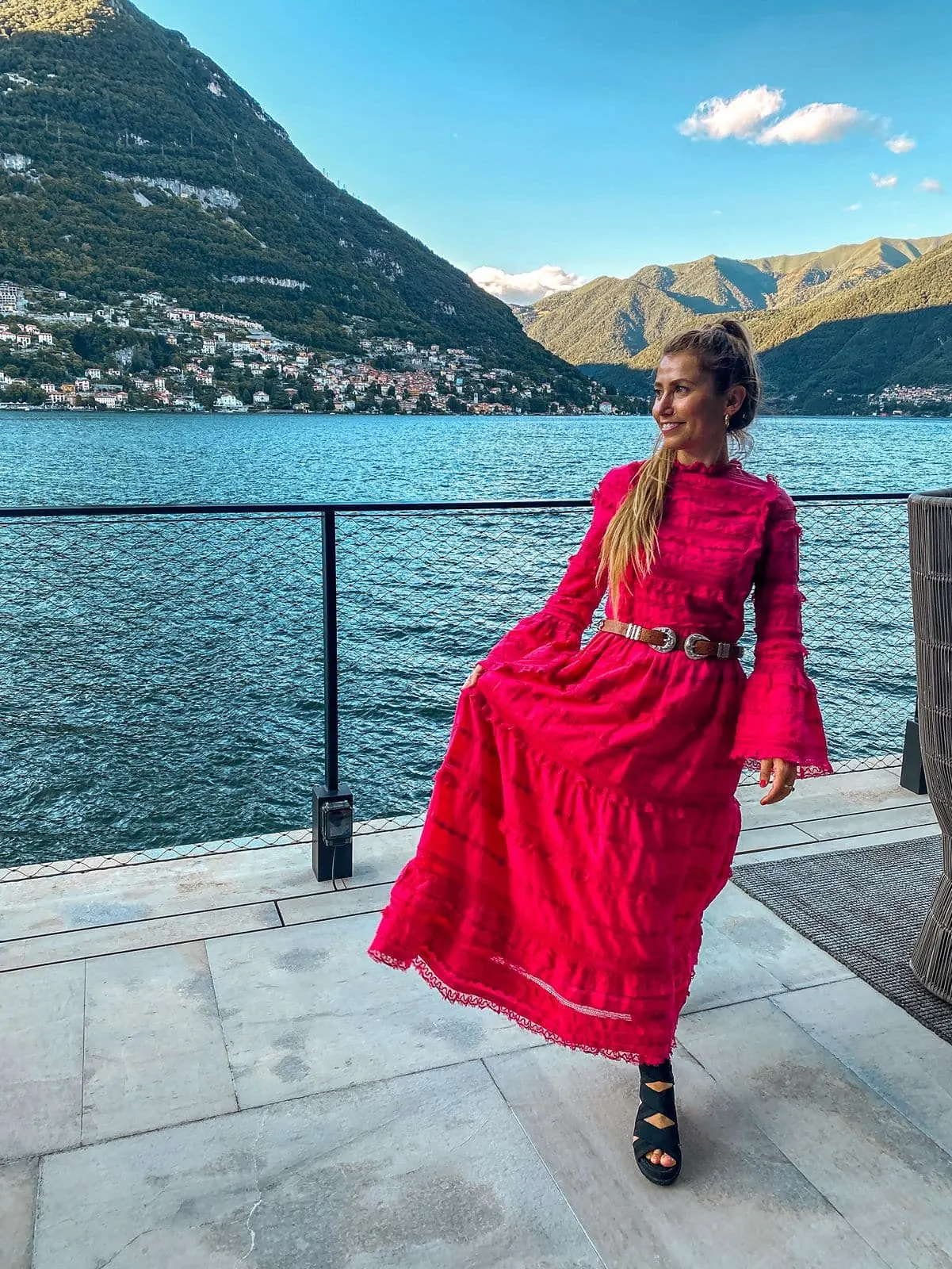 Woman walks balcony at Sereno Hotel in Lake Como
