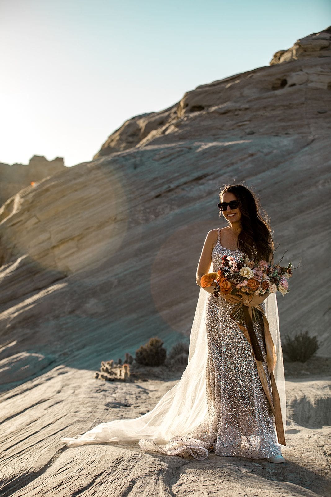 Bride holds bridal bouquet in Utah desert