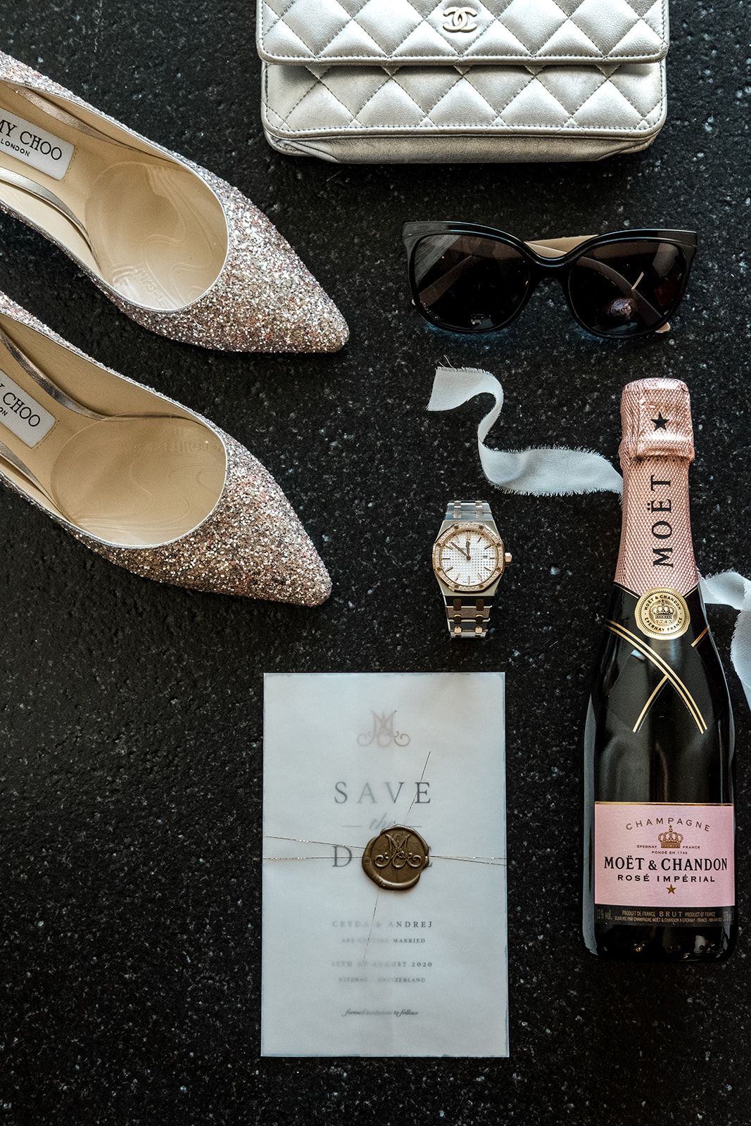 Classic bridal details including Moet Champagne and Jimmy Choo sparkling heels