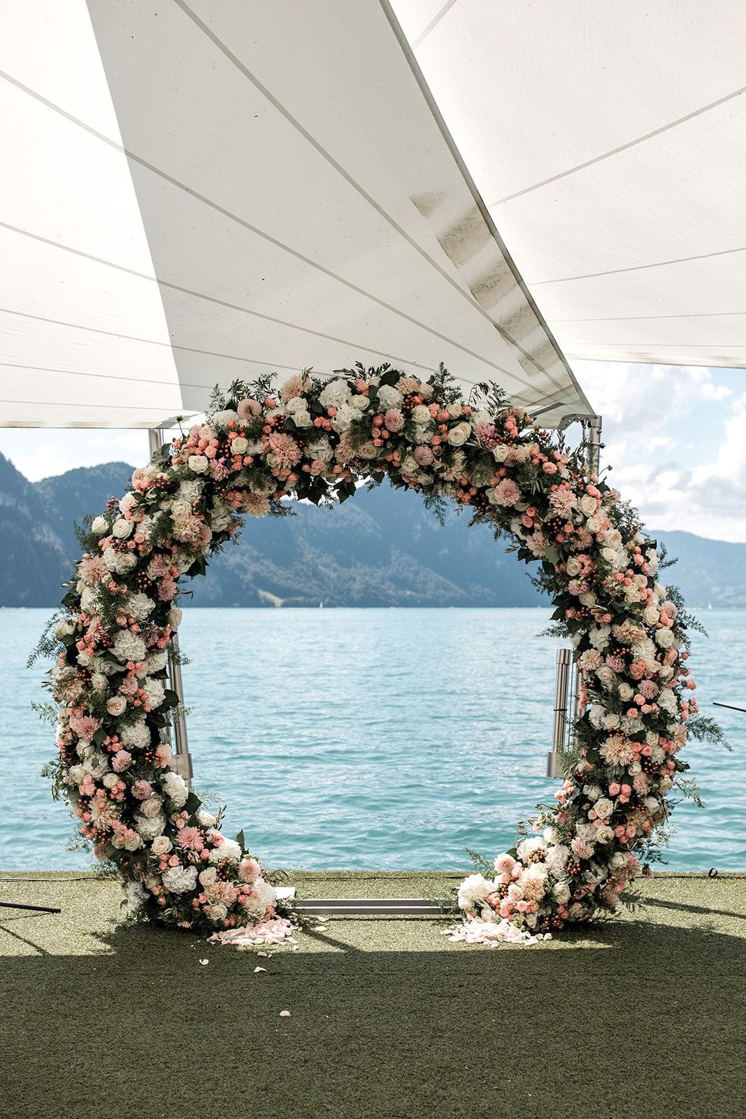 Wedding floral ceremony arch overlooking Lake Lucerne Switzerland