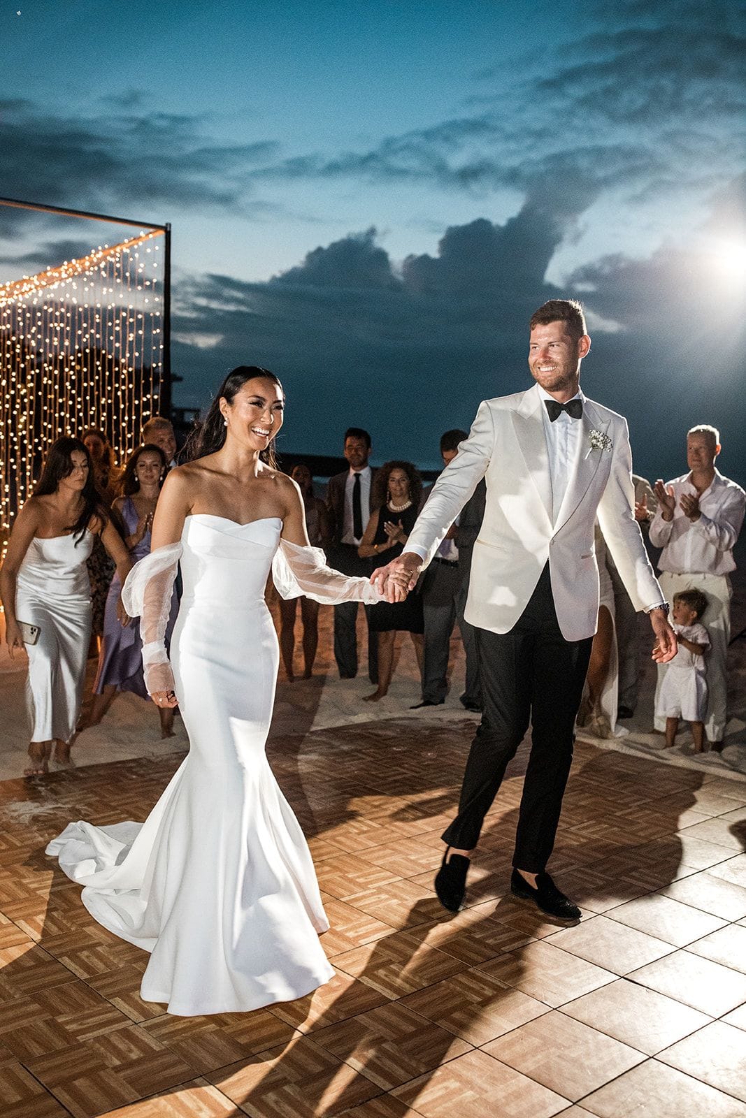 Bride and groom on beach dance floor at wedding reception in Anguilla