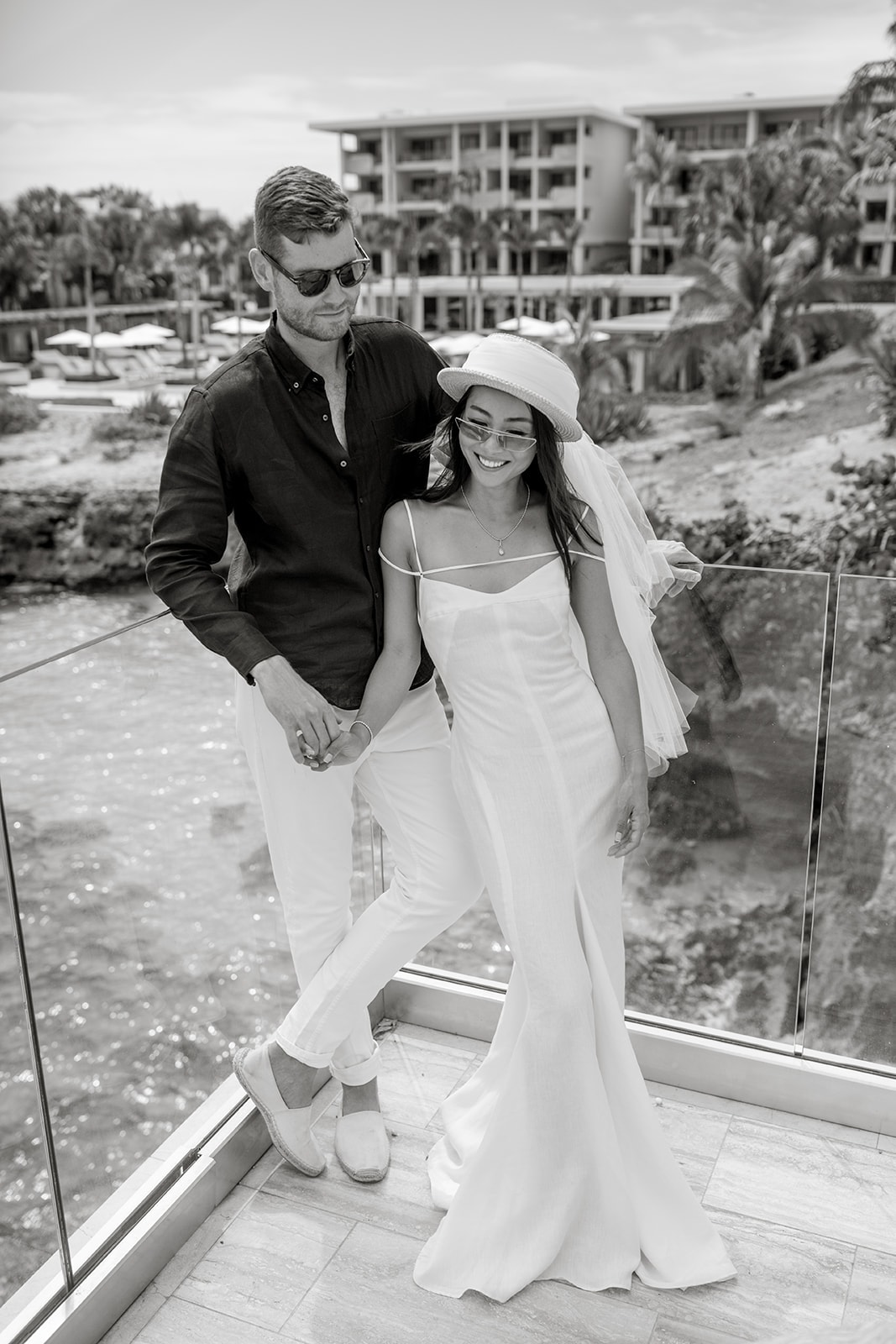 Couple stand on balcony at Four Seasons Anguilla