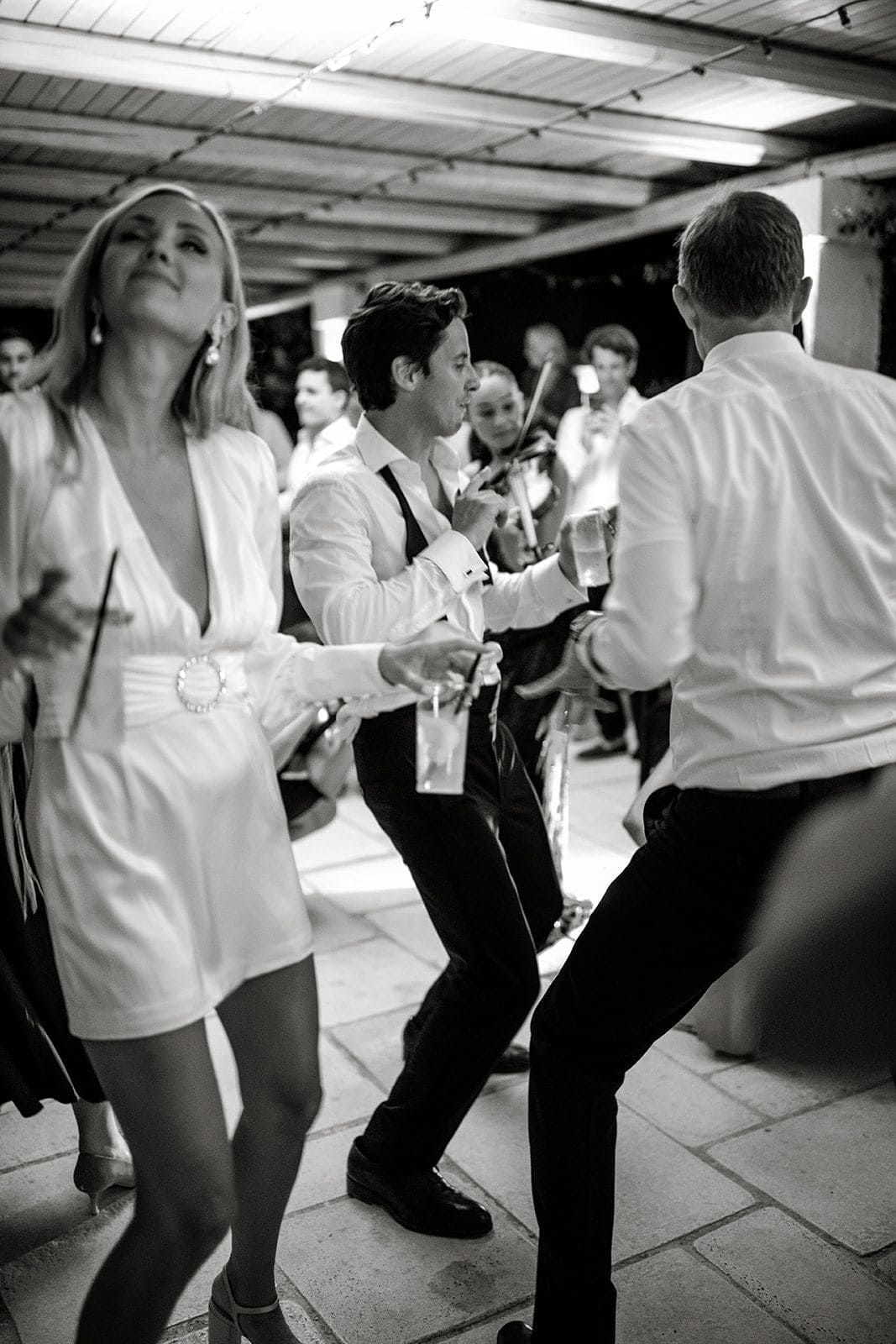 Bride and groom dance with their guests at Masseria Potenti wedding reception