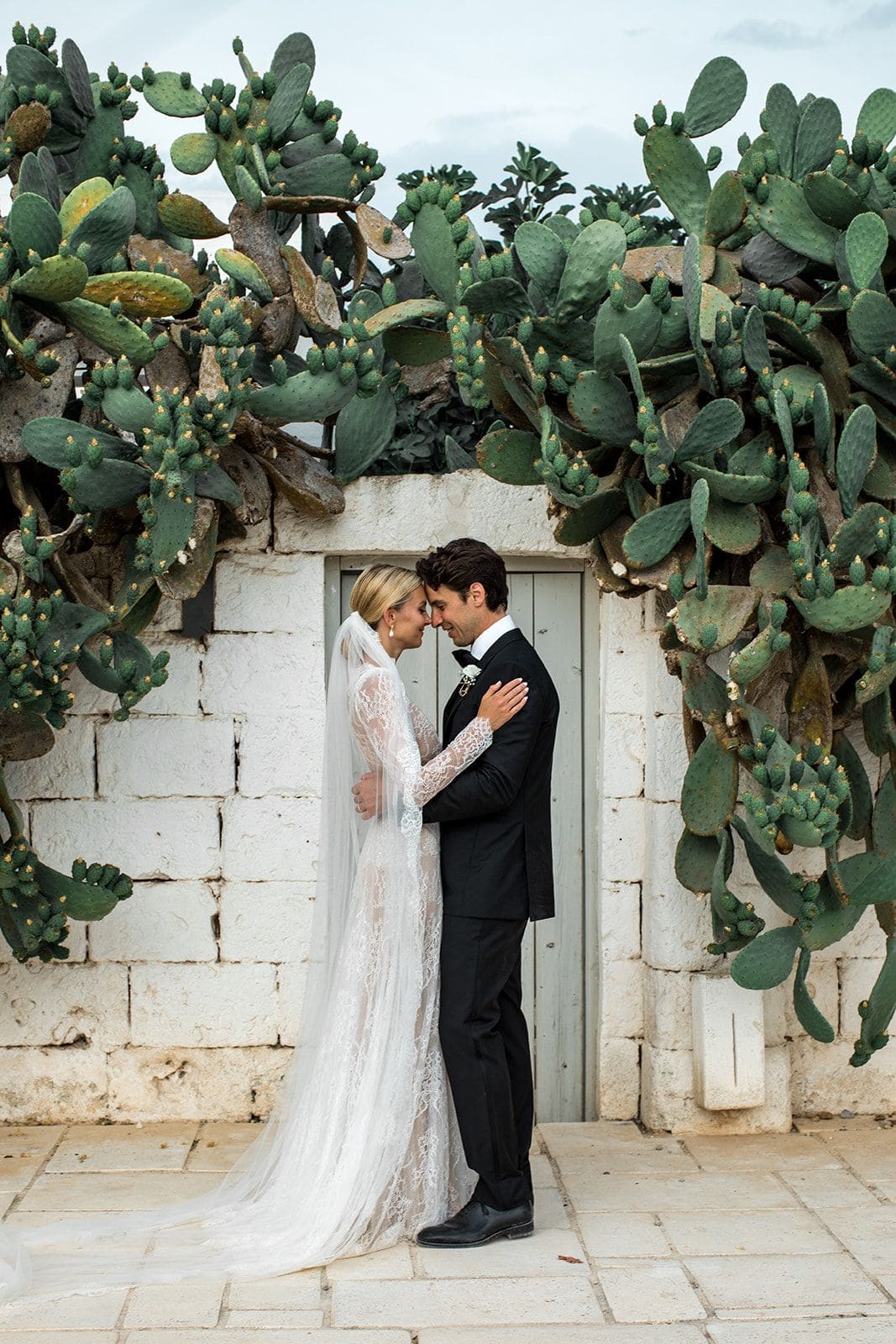 Bride groom embrace during first look portraits at Masseria Potenti wedding