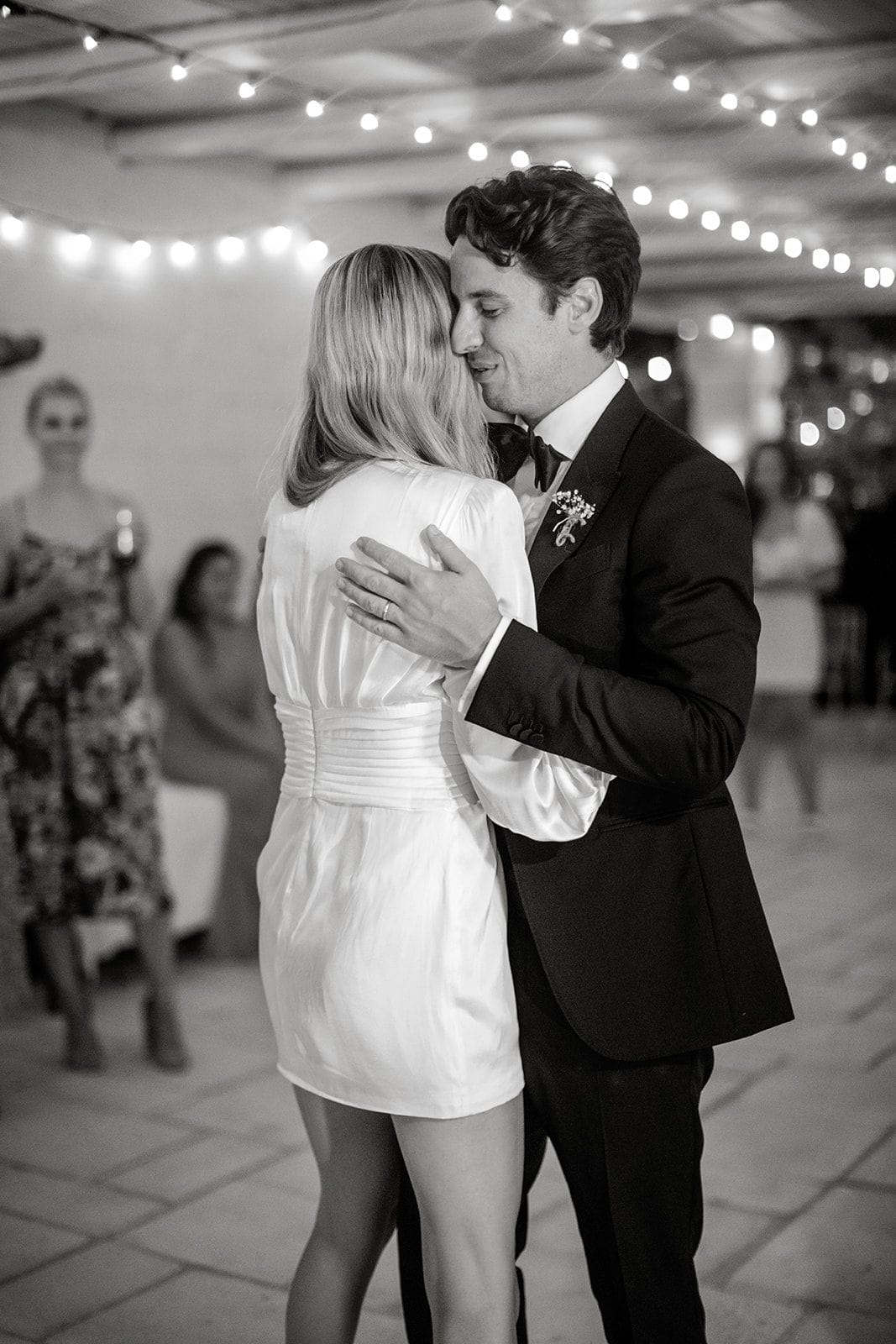 Bride and groom share first dance at wedding reception