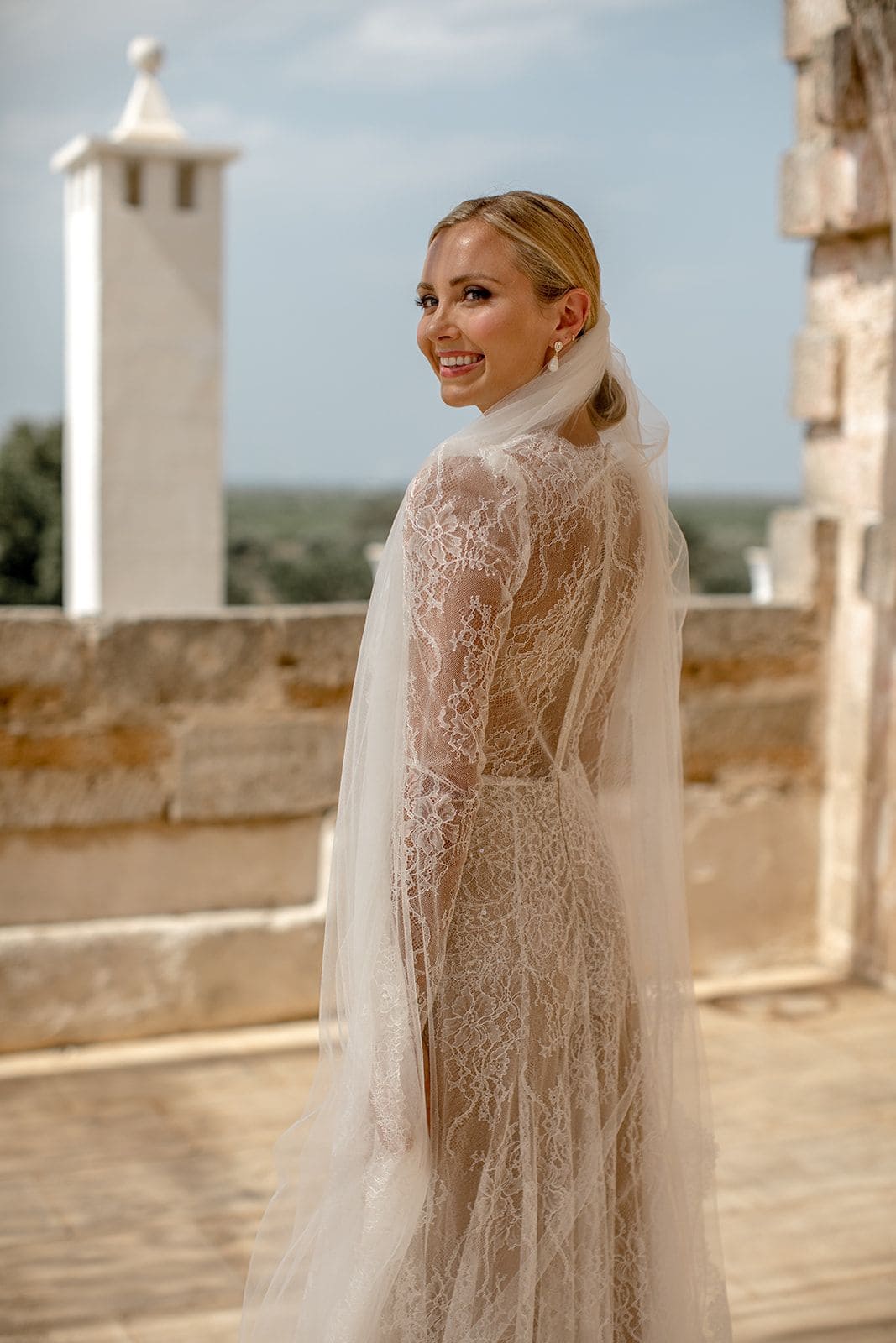 Bride wears lace wedding gown
