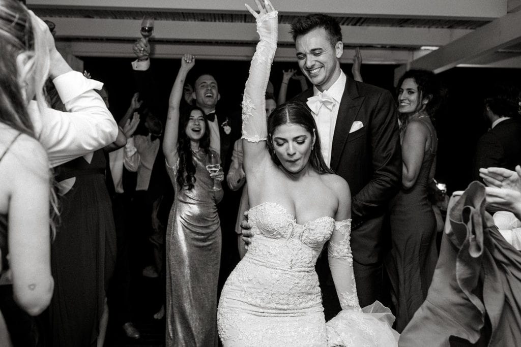 A bride and groom dance together during their wedding reception in Puglia, Italy. 